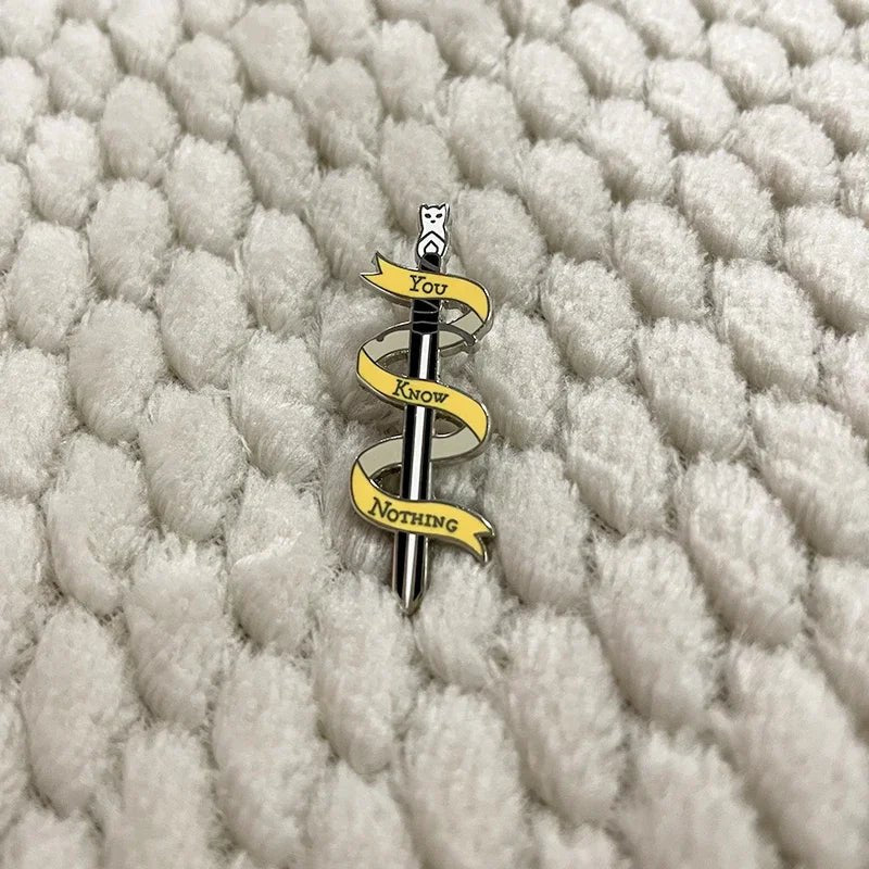 "You Know Nothing" Cat Sword Enamel Pin — Funny Pop Culture Badge